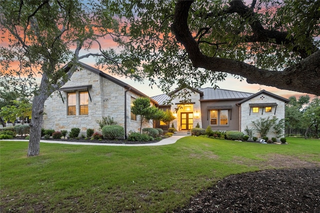 view of front of house with a lawn