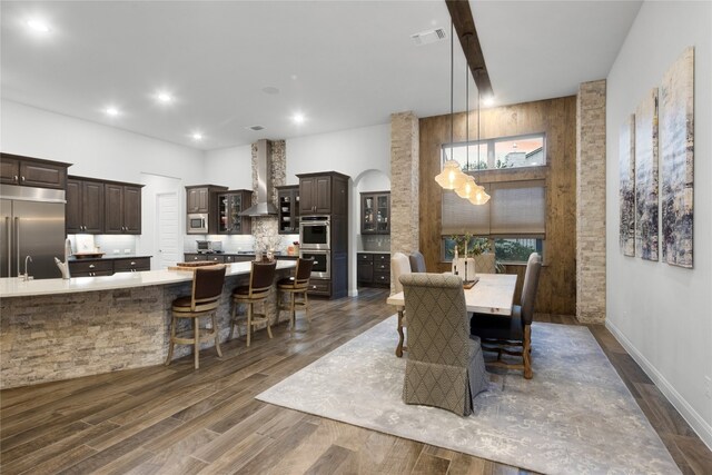 dining space with sink and dark hardwood / wood-style floors