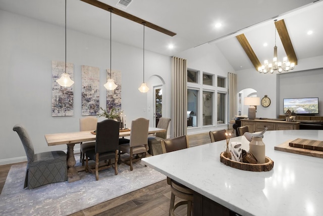 dining area featuring beamed ceiling, dark wood-type flooring, high vaulted ceiling, and an inviting chandelier