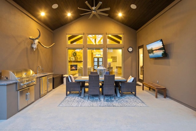 carpeted dining space with an outdoor fireplace, high vaulted ceiling, and wooden ceiling