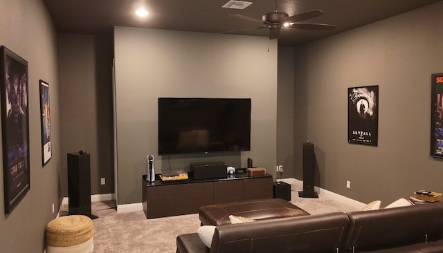 carpeted home theater room featuring ceiling fan