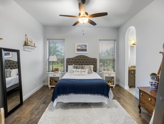 bedroom featuring multiple windows, ceiling fan, and dark hardwood / wood-style floors