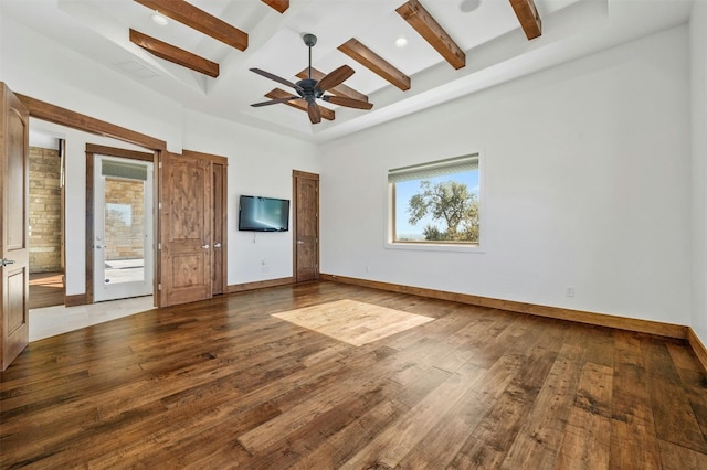 interior space with beamed ceiling, coffered ceiling, and hardwood / wood-style flooring