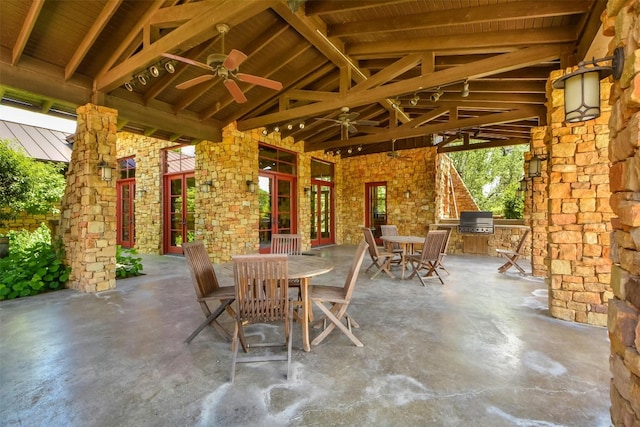 view of patio / terrace featuring an outdoor kitchen, ceiling fan, and a grill