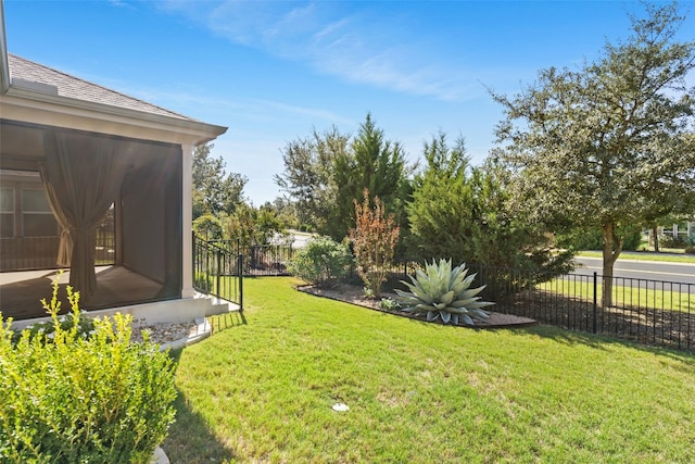 view of yard featuring a sunroom