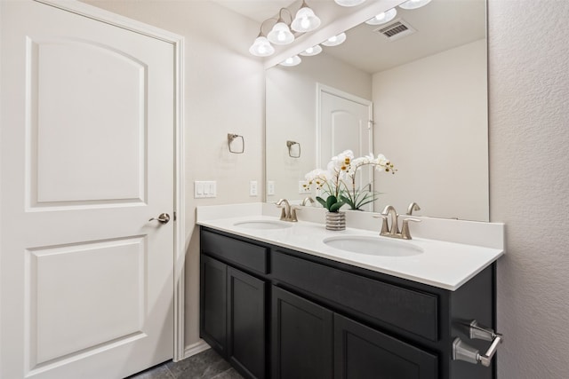 bathroom with tile patterned floors and vanity