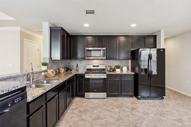 kitchen with sink, crown molding, tasteful backsplash, light stone counters, and stainless steel appliances