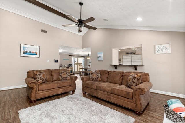 living room featuring ceiling fan, dark hardwood / wood-style flooring, crown molding, and high vaulted ceiling