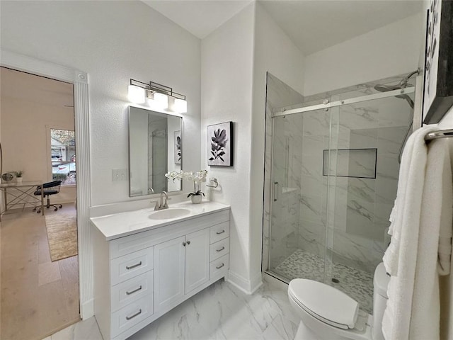 bathroom featuring hardwood / wood-style flooring, vanity, toilet, and a shower with shower door