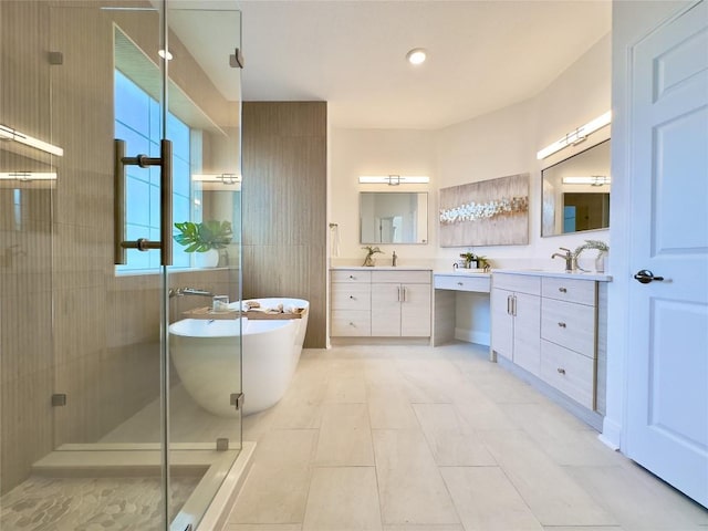 bathroom featuring tile patterned floors, vanity, and shower with separate bathtub