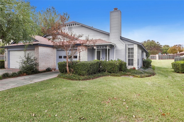 exterior space with a garage and a front yard