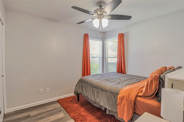 bedroom featuring ceiling fan and dark hardwood / wood-style flooring