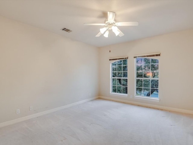 1624 Cabinwood Cv, Austin, TX 78746 - spare room with baseboards, carpet flooring, ceiling fan, and visible vents