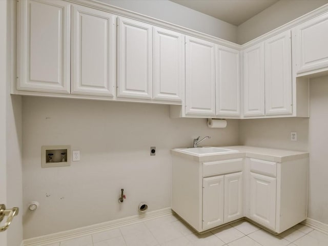 washroom with sink, hookup for a gas dryer, washer hookup, light tile patterned floors, and electric dryer hookup