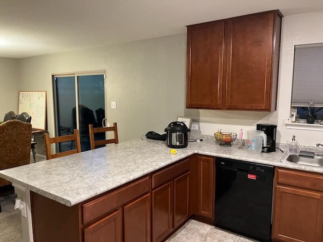 kitchen featuring kitchen peninsula, black dishwasher, and sink