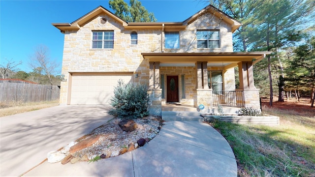 view of front of home with a porch and a garage