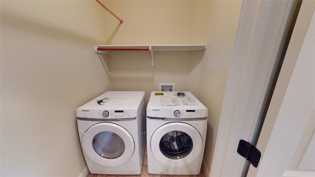 laundry room with washing machine and clothes dryer