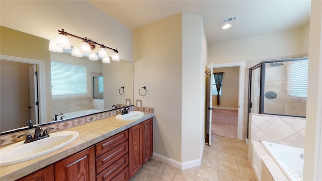 bathroom featuring tile patterned floors, vanity, and plus walk in shower