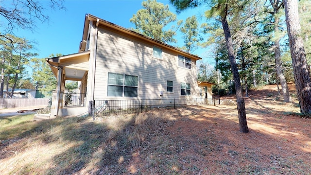 rear view of property with covered porch