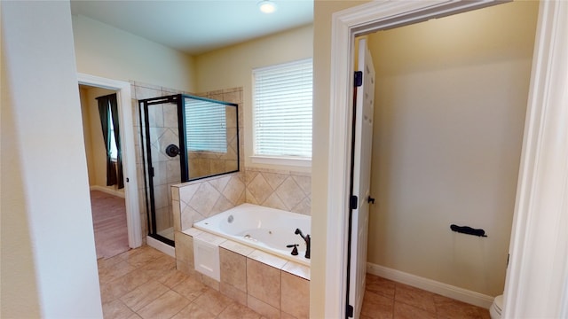 bathroom featuring plus walk in shower and tile patterned floors