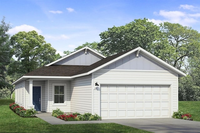 view of front of house featuring a front lawn and a garage