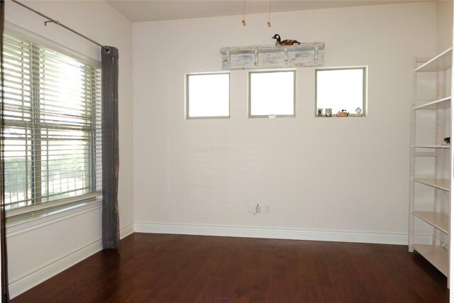 spare room featuring dark hardwood / wood-style floors