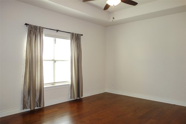 unfurnished room featuring ceiling fan and dark hardwood / wood-style floors