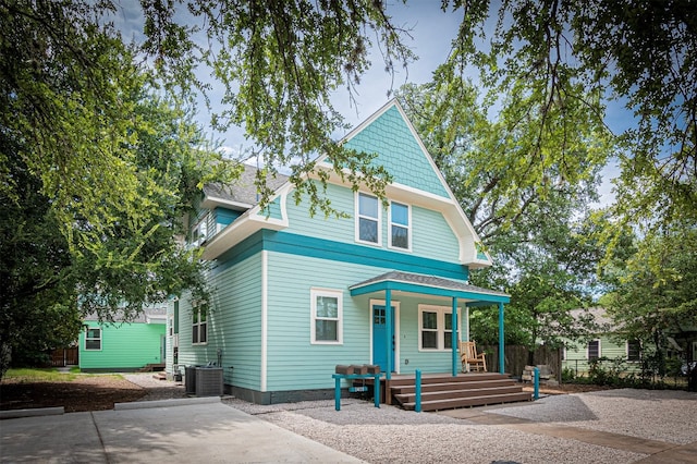 view of front of home with central air condition unit and covered porch