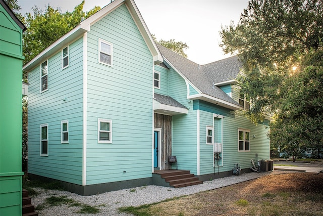 back of property with central air condition unit