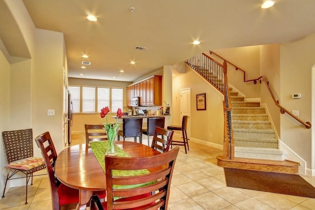 dining room with light tile patterned flooring