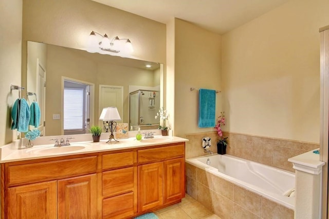 bathroom featuring vanity, independent shower and bath, and tile patterned flooring