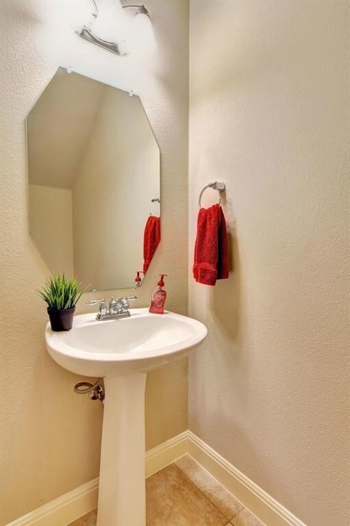 bathroom with tile patterned floors and sink