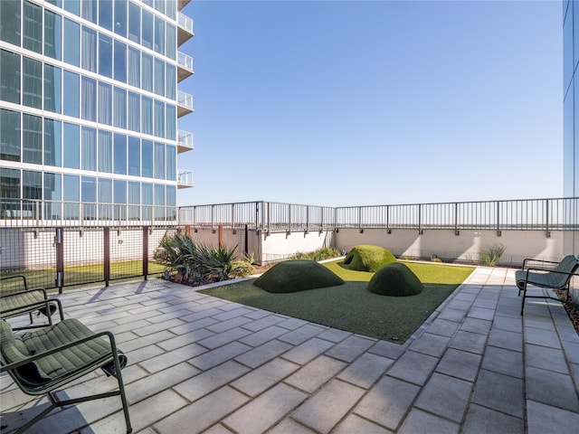 view of patio featuring fence