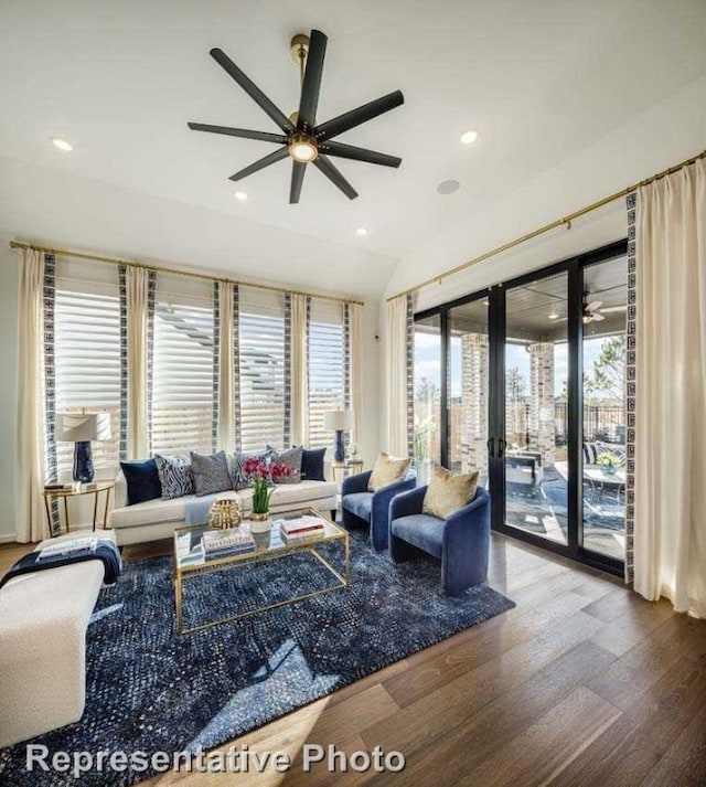 living room featuring hardwood / wood-style flooring, ceiling fan, a healthy amount of sunlight, and vaulted ceiling