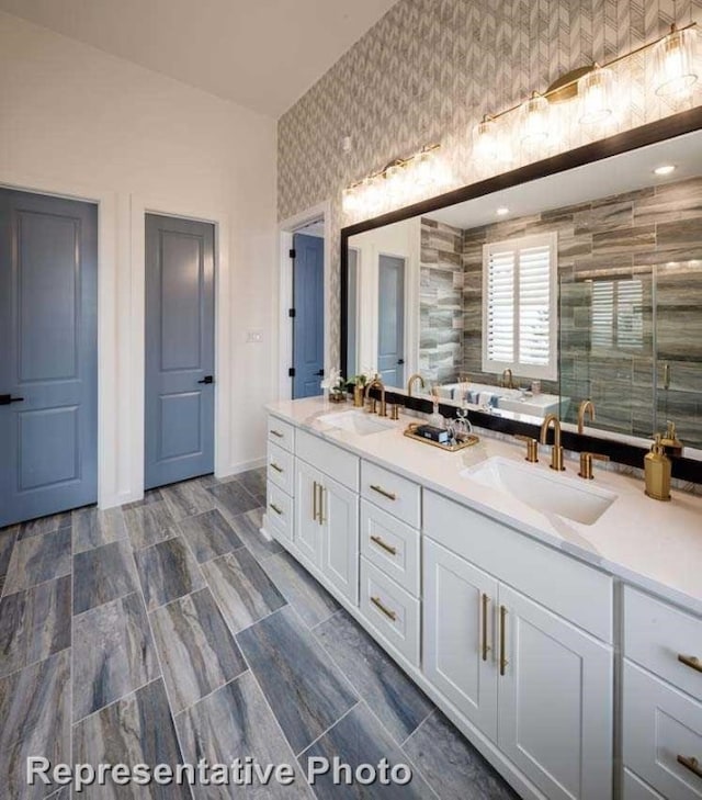 bathroom featuring separate shower and tub, vanity, and tile walls