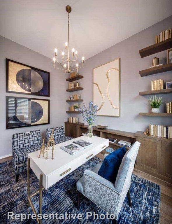 dining room featuring dark hardwood / wood-style floors and an inviting chandelier