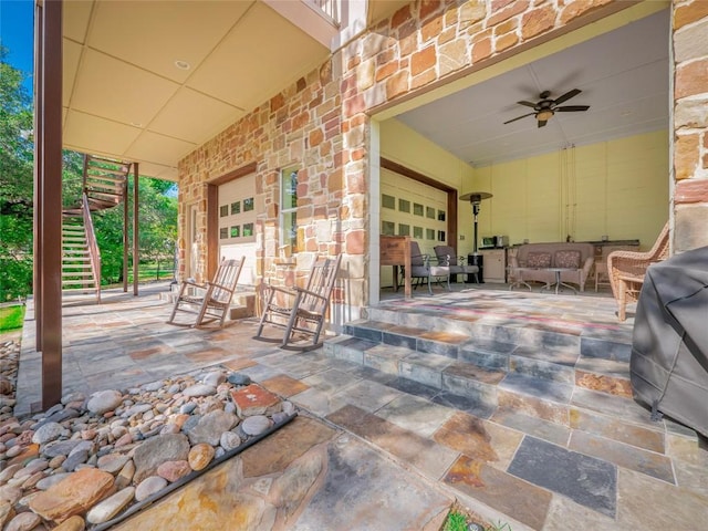 view of patio featuring area for grilling and ceiling fan