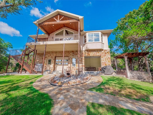 rear view of house with a patio and a yard