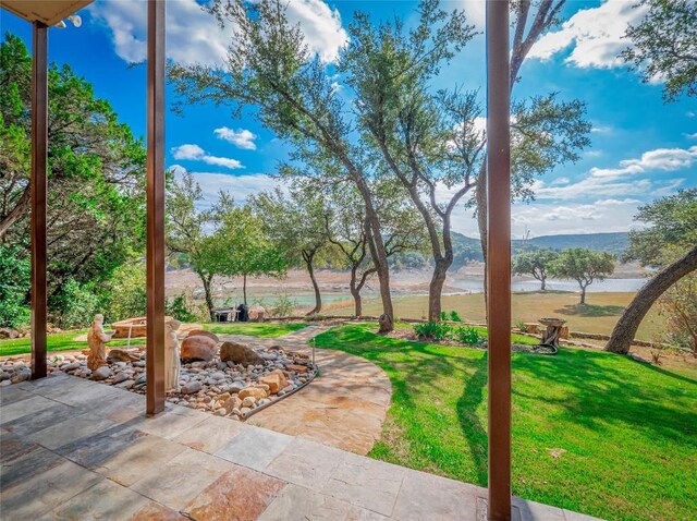 exterior space with a water and mountain view