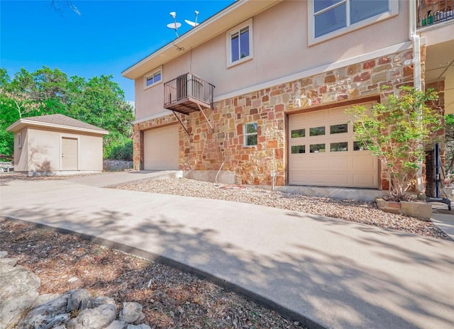 exterior space featuring a balcony and a garage