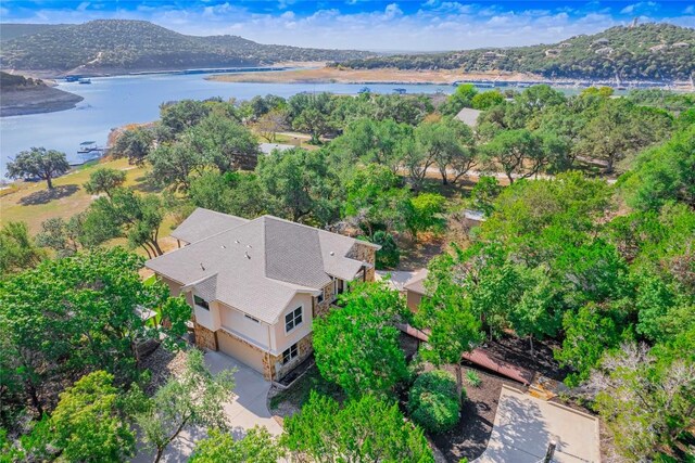 birds eye view of property featuring a water and mountain view