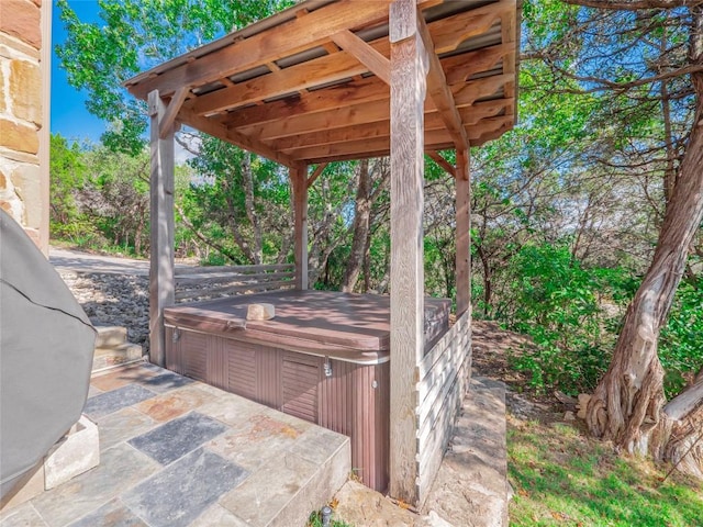 view of patio / terrace with a hot tub