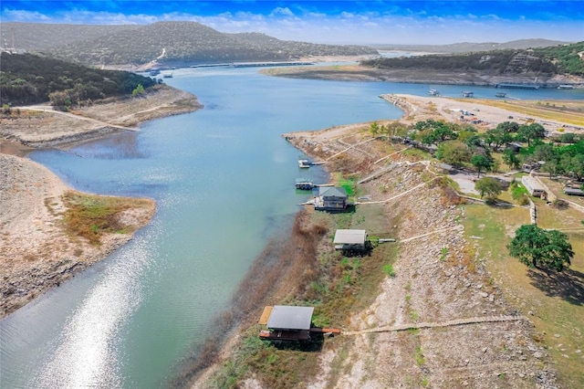 bird's eye view featuring a water and mountain view