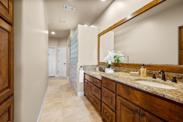 bathroom with tile patterned flooring and vanity