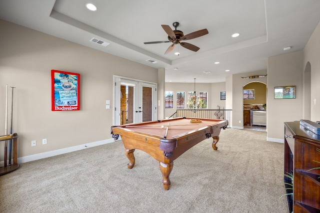 playroom with ceiling fan, french doors, a tray ceiling, light carpet, and pool table