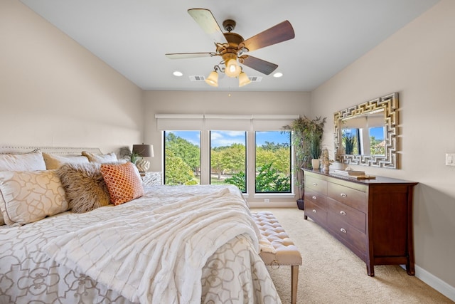 bedroom with ceiling fan and light colored carpet