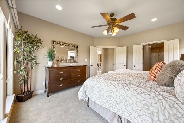 bedroom featuring ceiling fan and light colored carpet