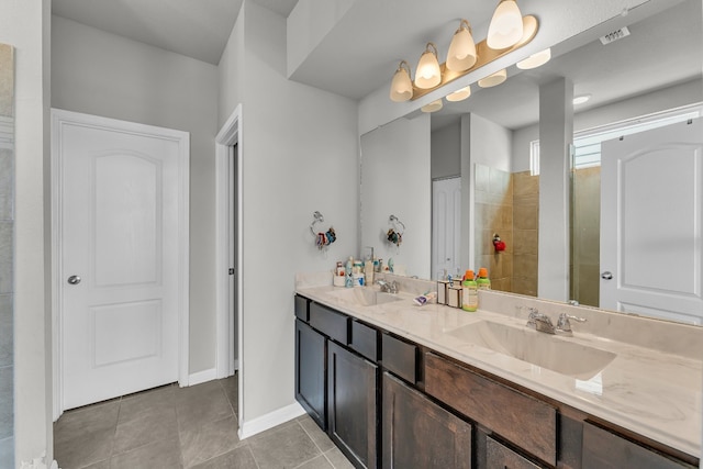 bathroom featuring tile patterned flooring and vanity