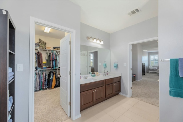 bathroom with tile patterned floors and vanity