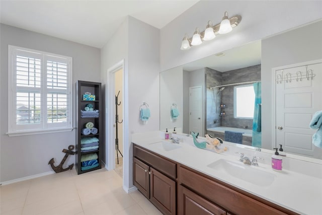 bathroom with tile patterned floors, vanity, and independent shower and bath